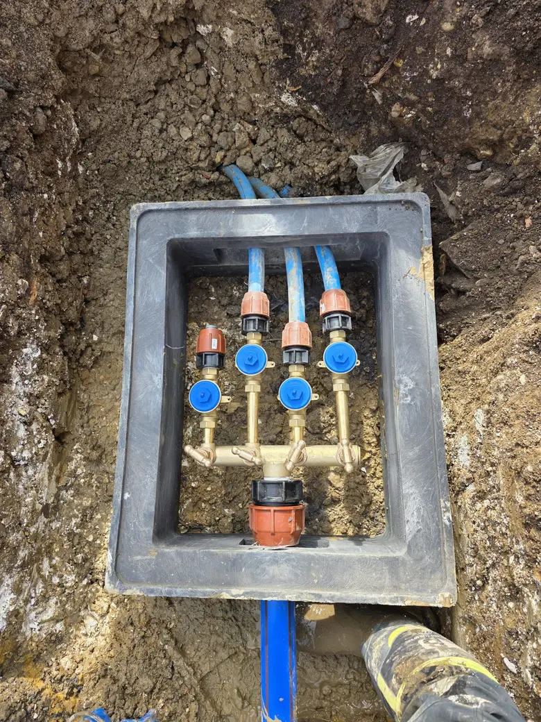 Multi-port service manifold of the type installed to give each property its own metered supply