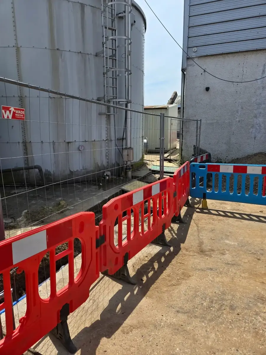 Fire tanks at the Watford site with barriers in place and the excavation open alongside