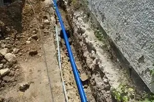 Water main and 32mm service pipe run together in a shared trench